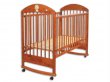 Postýlka Drewex Lion teak se stahovací bočnicí a houpačkou Postýlka Drewex Lion teak se stahovací bočnicí a houpačkou
